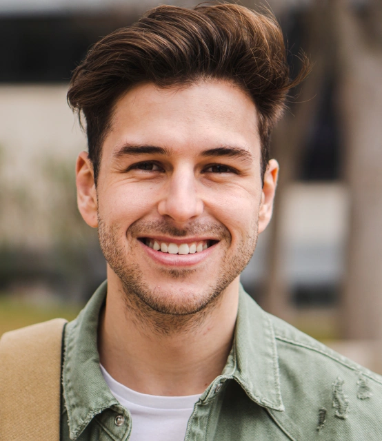 Patient smiling after professional teeth whitening treatment